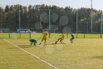 Football game. Training matches junior teams and fans.