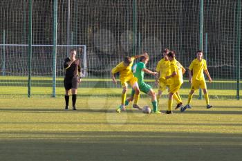 Football game. Training matches junior teams and fans.