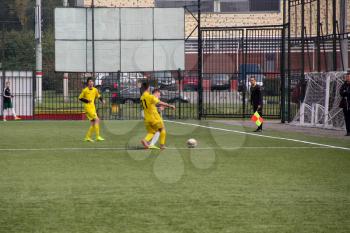 Football game. Training matches junior teams and fans.