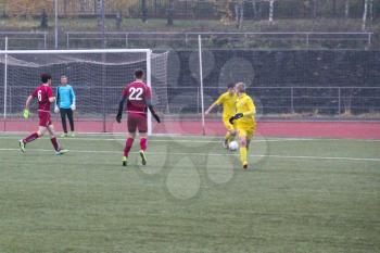 Football game. Training matches junior teams and fans.