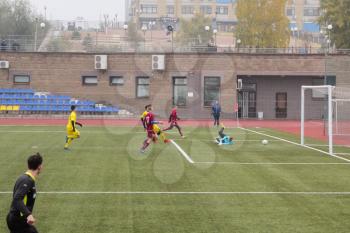 Football game. Training matches junior teams and fans.