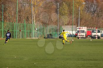 Football game. Training matches junior teams and fans.