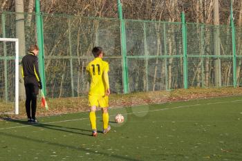 Football game. Training matches junior teams and fans.