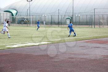 Football game. Training matches junior teams and fans.