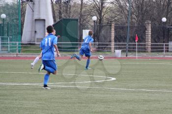 Football game. Training matches junior teams and fans.