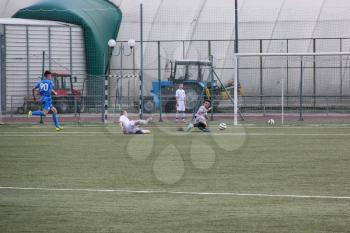 Football game. Training matches junior teams and fans.