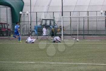 Football game. Training matches junior teams and fans.