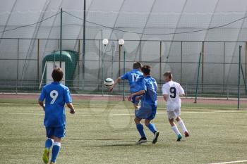 Football game. Training matches junior teams and fans.