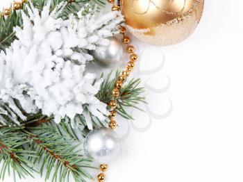 Christmas background with golden decorations   and fir branch 