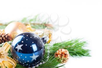 Christmas decorations and green pine branch on a white background
