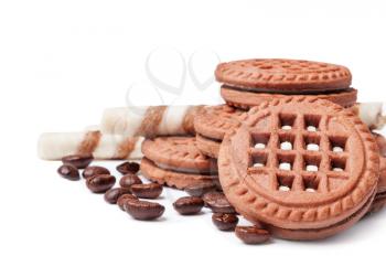 Chocolate cookies and coffee beans on a white background