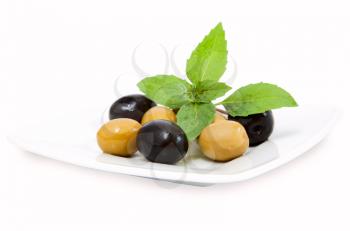 black and green olives on white plate