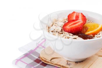 Porridge  with fresh strawberry on a white background