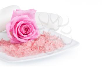 Soap, pink rose and aromatic salt on a white background