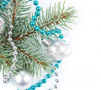 Christmas background with blue bead, white decoration and fir branch 
