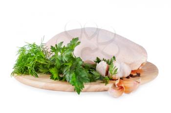 Raw chicken breast with green parsley and garlic
