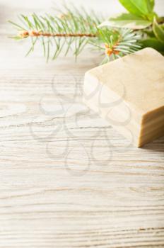Bar of natural herbal handmade soap on a wooden background