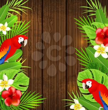 Tropical flowers, green palm leaves and red parrots on a wooden background