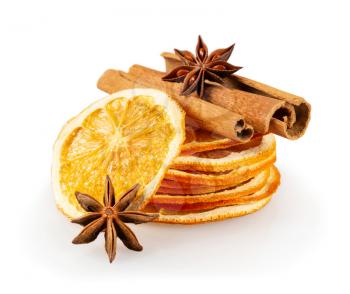 Stack of dried orange slices, cinnamon and star anise. Spices for mulled wine on a white background.