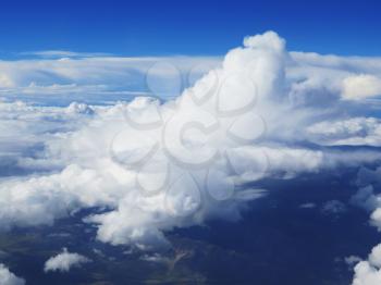 white fluffy clouds closeup in the blue sky