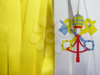 Vatican flag or banner made with Yellow and white ribbons
