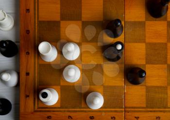 old chess on a chess classic wooden board on a dark background