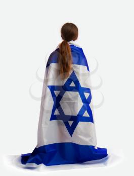 The little Jewish girl is looking at the viewer, and wrapped his shoulders a large flag of Israel