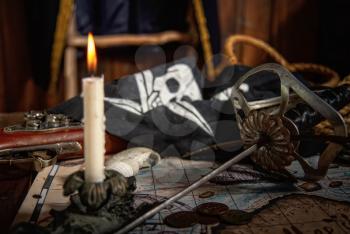 Items from pirated goods randomly laid out on the old ship's table