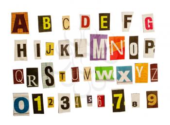 latin alphabet and numbers for anonymous letters in order to remain unidentified cut out by scissors from different newspapers isolated on white background