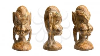 Old dark traditional wooden African figurine on a white background in three angles
