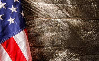 beautiful starry striped flag of united states of america on dark wooden background