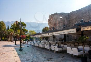 Budva - Montenegro, 1 August: Street cafes empty from quarantine and empty tables of the tourist town of Budva in wonderful sunny weather