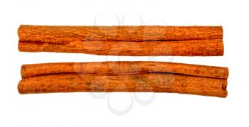 two sticks of dry cinnamon close-up on a white background