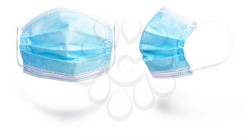 two thin protective medical masks in different positions isolated on white background 