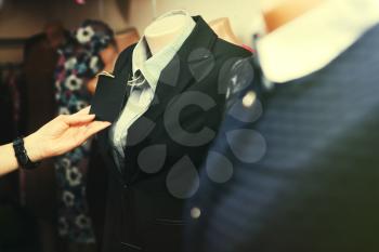 Clothes hanging on the rack in the fashion store