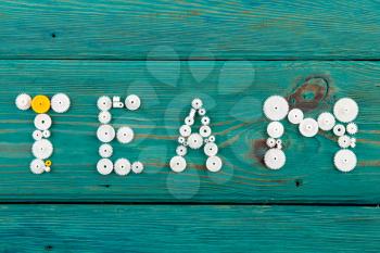 Team - word composed of the gears on the wooden desk