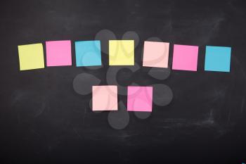 Colorful sticky notes on the blank blackboard