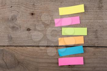 Colorful sticky notes on the wooden board