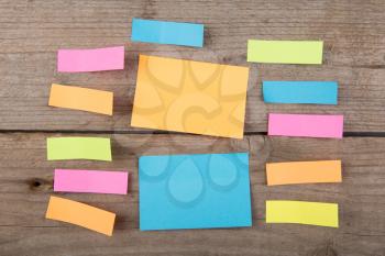Colorful sticky notes on the wooden board