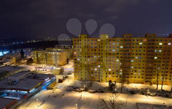 Communist residential blocks and houses at night.