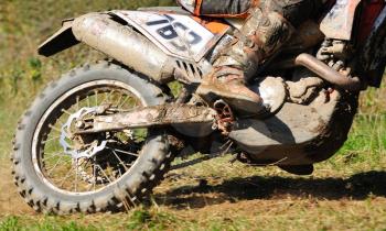 Detail view to the wheel of motocross bike.