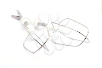 A set of two kitchen whisks placed on a white background.