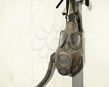 Old gas mask hanging on the wall.