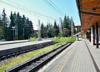 Empty platforms without trains and people at terminal railway station Strbske pleso in High Tatras, Slovakia.