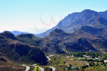 View of  Gran Canaria mountains valley with curvy road.