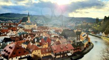 Panoramic aerial view of beautiful town Cesky Krumlov with Vltava river. Photo was taken against the sun.