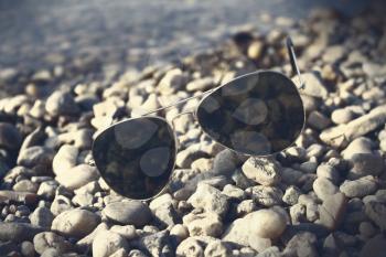 Sunglasses resting on the beach