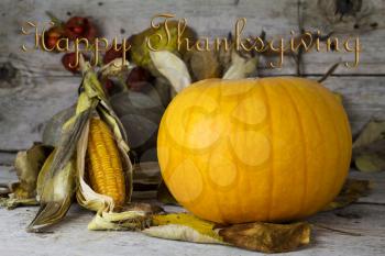 Happy Thanksgiving Day, Decoration on a wooden table with Pumpkins, Corncob and autumn leaves