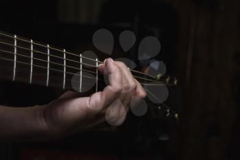 Acoustic Guitar Player Performing. Guitarist Playing In Music Studio