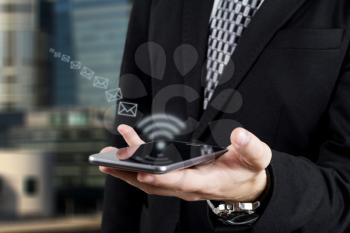 Businessman Sending Mail via Smartphone. Digital Wireless Technology and Networking 